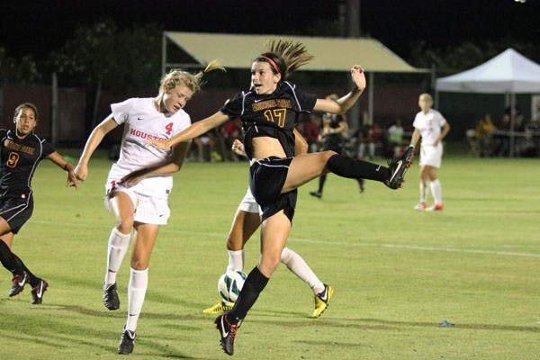Junior forward Carli Farquharson (17) leaps in the air for the ball during the Sun Devils’ meeting against Houston last Friday. (Photo by Kyle Newman)