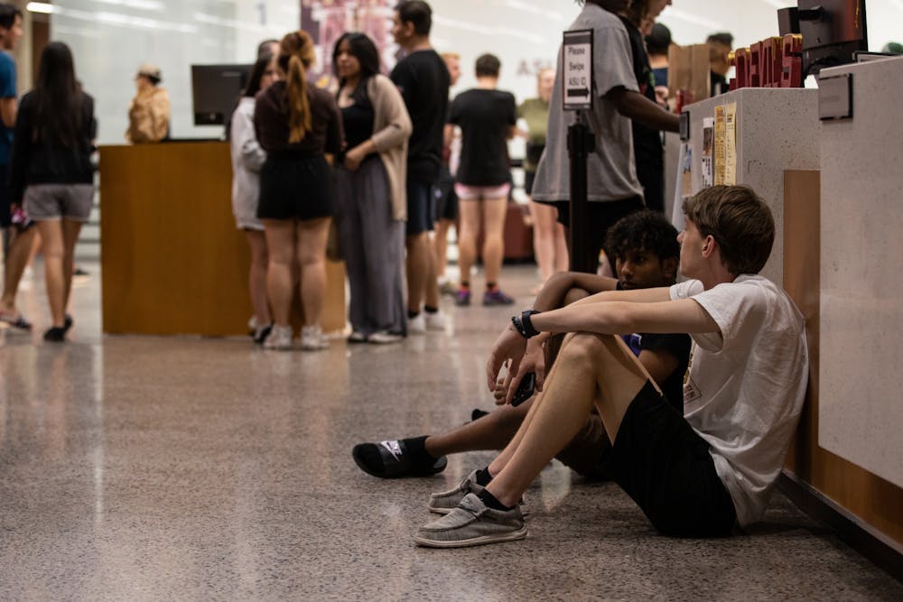 Evacuated students wait at SDFC