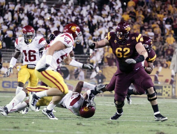 ALMOST THERE: ASU sophomore offensive lineman Evan Finkenberg runs to make a block for sophomore wide receiver Kyle Middlebrooks during the Sun Devils’ win over USC in September. If Finkenberg is healthy on Saturday, then the Sun Devils’ offensive line will be intact for the first time all season. (Photo by Beth Easterbrook)