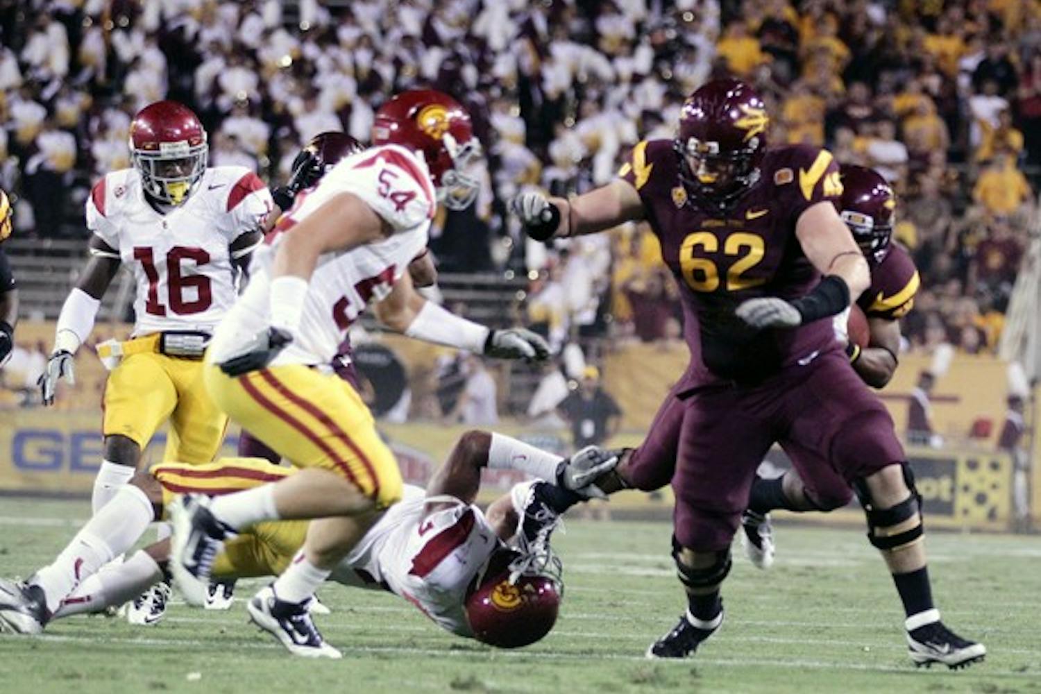 ALMOST THERE: ASU sophomore offensive lineman Evan Finkenberg runs to make a block for sophomore wide receiver Kyle Middlebrooks during the Sun Devils’ win over USC in September. If Finkenberg is healthy on Saturday, then the Sun Devils’ offensive line will be intact for the first time all season. (Photo by Beth Easterbrook)