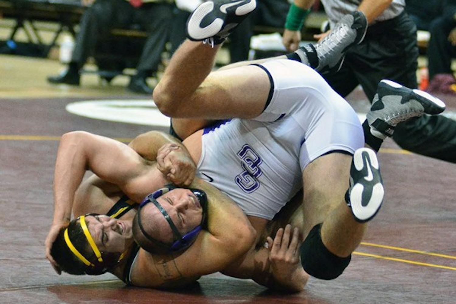 Undefeated: ASU senior Anthony Robles tilts Cal Poly redshirt freshman Britain Longmire during Robles’ 15-0 technical fall victory. The win improved Robles’ record to 24-0, but the Sun Devils ultimately fell to the Mustangs, 40-11. (Photo by Rosie Gochnour)