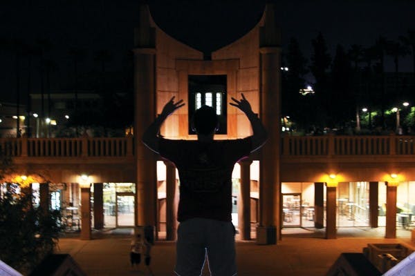 Junior business major and member of the Delta Kappa Epsilon fraternity, Domenick Schepf, poses outside Hayden Library on Thursday night. Rush starts this weekend for sororities and next week for fraternities. (Photo by Jenn Allen)