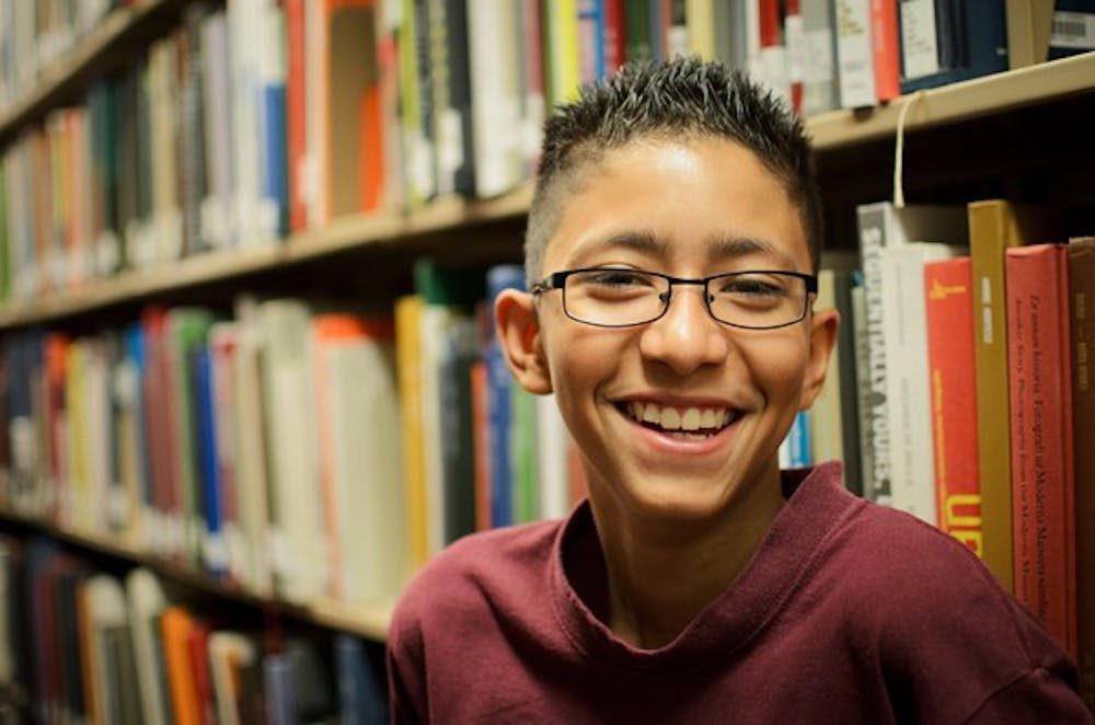 Javier Urcuyo is seen at the Noble Science and Engineering Library on the Tempe campus Monday. Urcuyo, who is only 12 years old, is one of the youngest students to take college-level courses at ASU.  (Photo by Aaron Lavinsky)