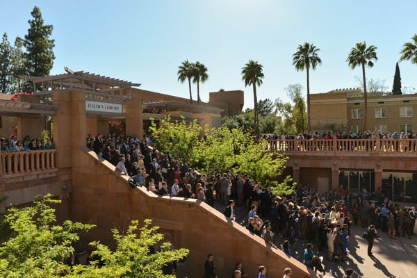 Students gather around Hayden Library to watch the unveiling of the Session B results. (Photo by Andrew Ybanez)