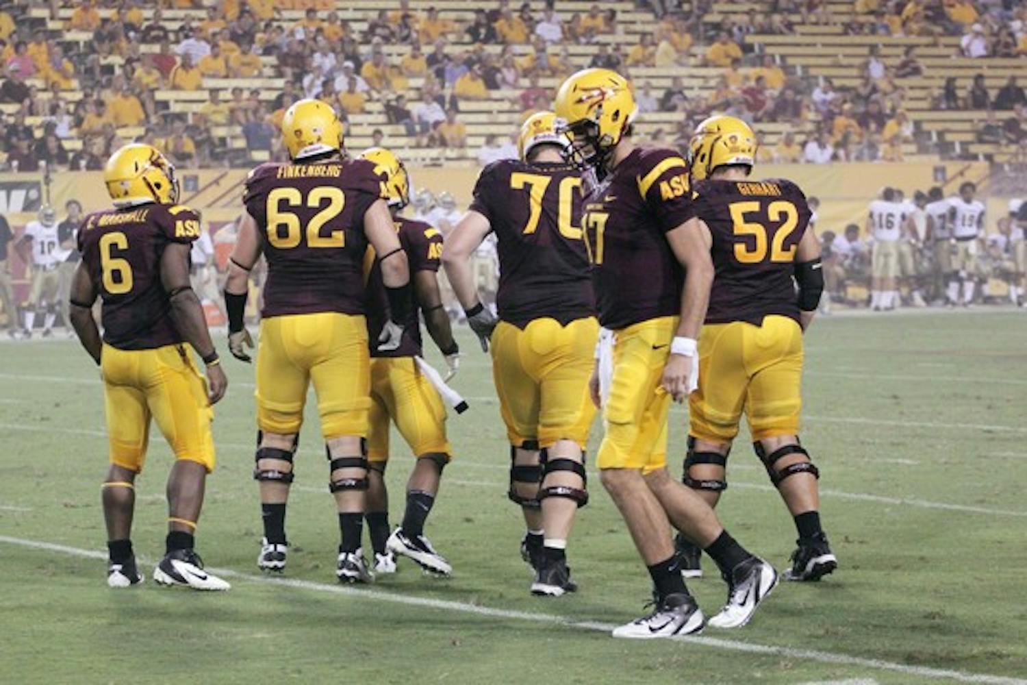 ANOTHER BLOW: ASU sophomore Evan Finkenberg (62) and the rest of the Sun Devil offense walk up to the line of scrimmage during ASU’s win over UC Davis on Sept. 1. Finkenberg will be out for four to six weeks due to a knee injury. (Photo by Beth Easterbrook)