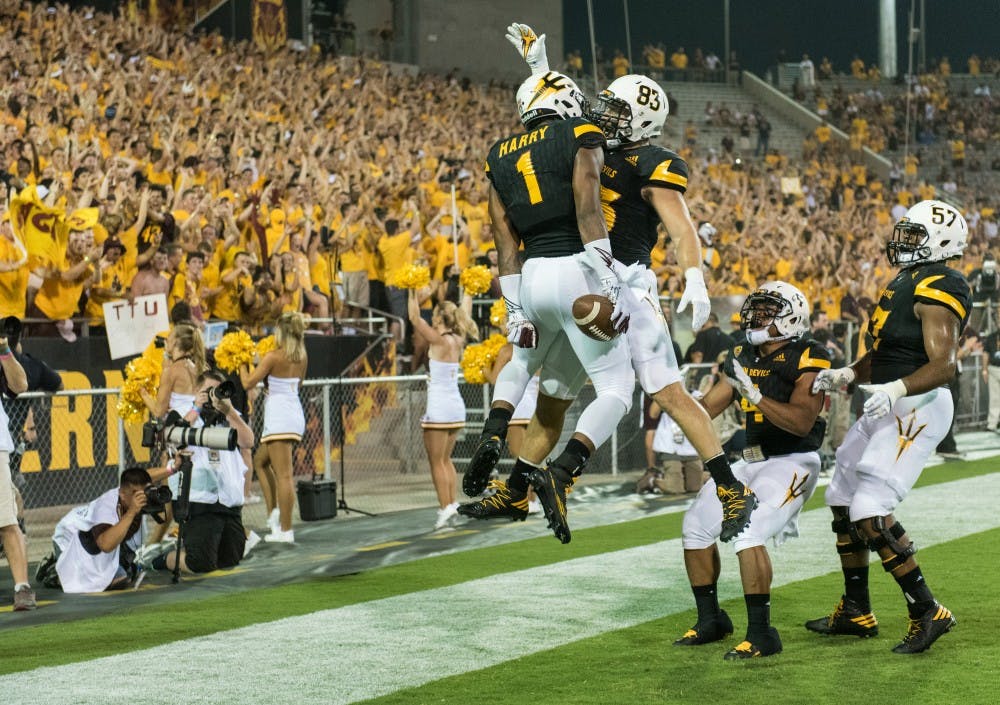 Freshman wide receiver N'Keal Harry celebrates with senior tight-end Kody Kohl after scoring a touchdown in the first quarter against Texas Tech on Sept. 10, 2016 at Sun Devil Stadium,  in Tempe, Arizona.