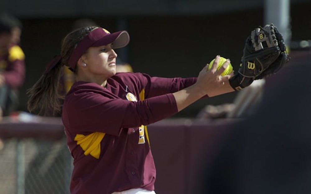 ARMED AND READY: ASU freshman Sam Parlich gets ready to throw a pitch during the Sun Devils’ 14-0 victory against Rutgers on Feb. 21. The Sun Devils won three games in the Judi Garman Classic in Fullerton, Calif. over the weekend. (Photo by Michael Arellano)