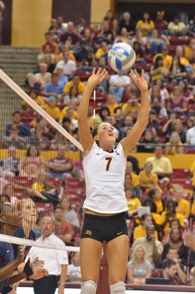 UP AND OVER: Junior setter Cat Highmark jumps to set up a teammate during last weekend's match with UA. The Sun Devils split a pair of matches over the weekend, sweeping Oregon State 3-0 and falling 2-3 to Oregon. (Photo by Aaron Lavinsky)