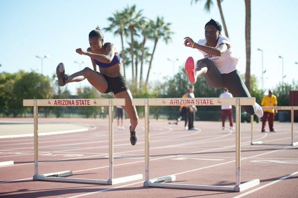 Midseason test: ASU sophomores Keia Pinnick and Christabel Nettey work on hurdles during a practice earlier in the season. The Sun Devils travel to Seattle for the Mountain Pacific Sports Federation Indoor Championships this weekend. (Photo by Michael Arellano)