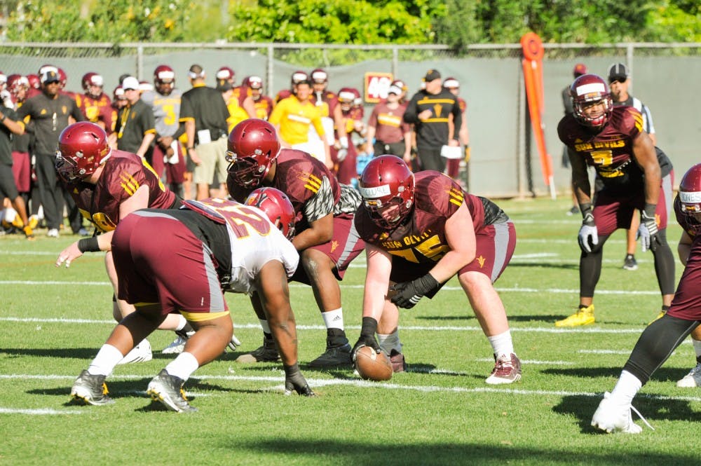 The linemen wait for the ball to be snapped during an ASU&nbsp;football practice at Kajikawa Practice Facility&nbsp;on Friday,&nbsp;March 18, 2016.