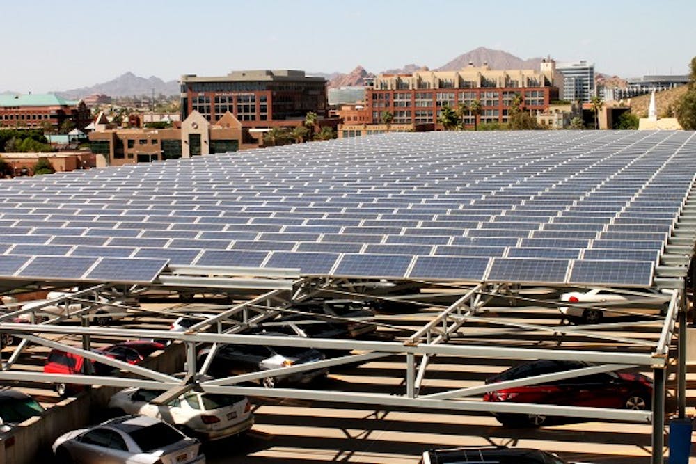 Solar panels top many parking garages, buildings and other structures around ASU's campuses, like the 10th Avenue lot seen here. For the past couple of years, solar energy has had a large impact on power at ASU. (Photo by Laura Davis)