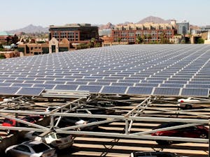 Solar panels top many parking garages, buildings and other structures around ASU's campuses, like the 10th Avenue lot seen here. For the past couple of years, solar energy has had a large impact on power at ASU. (Photo by Laura Davis)