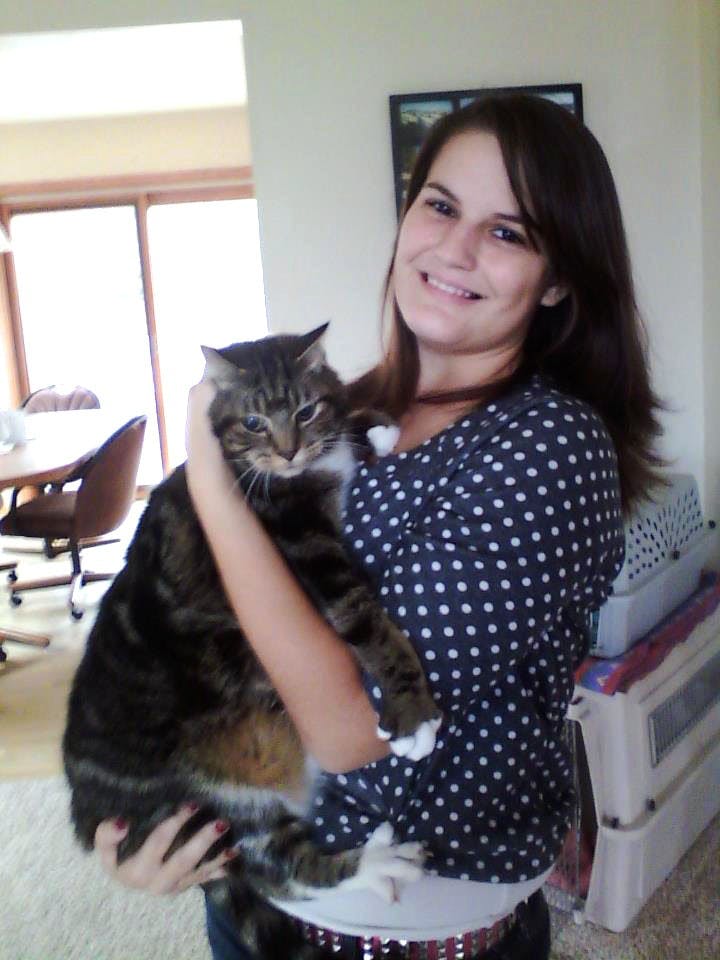 Rebecca Kasper holds her cat as she poses for the camera. Kasper was murdered by her boyfriend earlier in May, and the case is still ongoing. 
(Photo Courtesy of the Kasper family)
