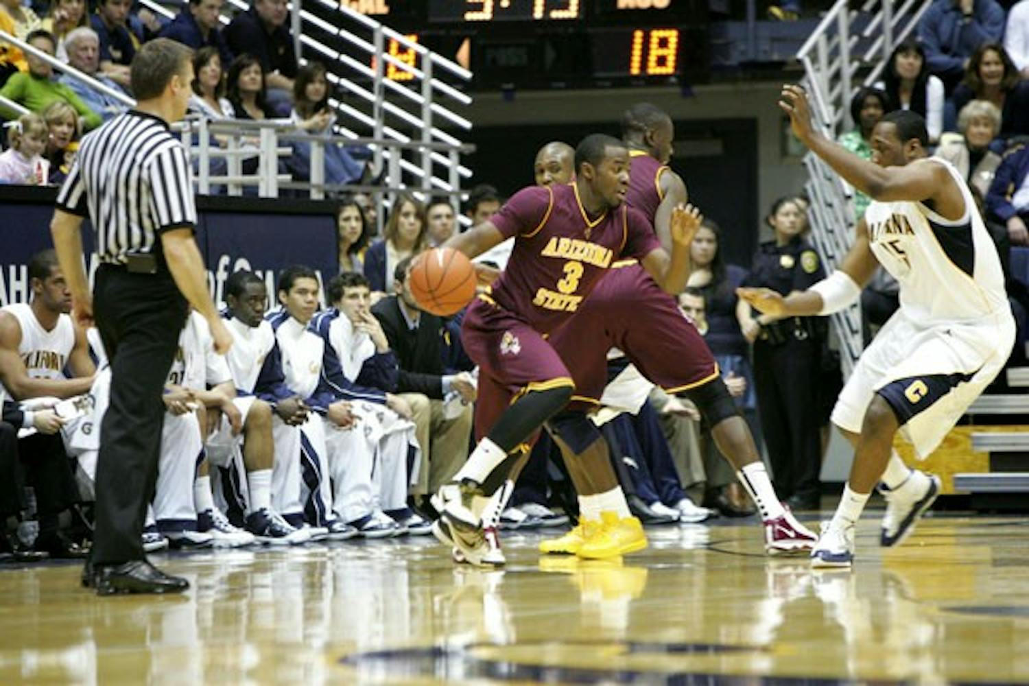 PICK AND ROLL: ASU junior guard Ty Abbott comes off of a screen set by senior center Eric Boateng during the Sun Devils’ 62-46 loss to California at Haas Pavilion on Saturday. (Photo by Anne Marie Schuler)