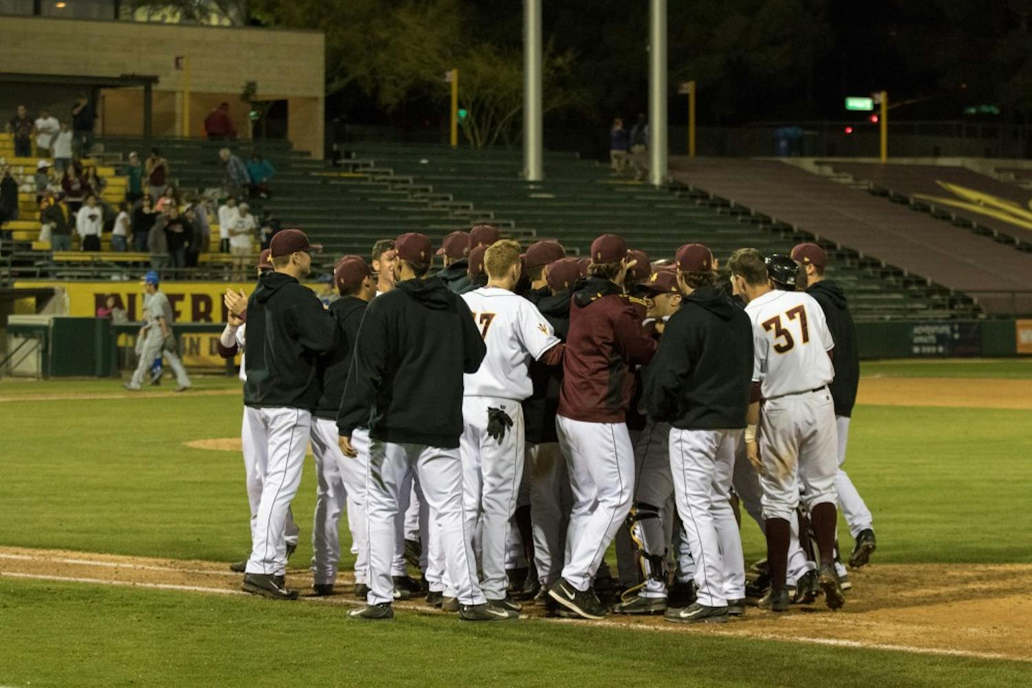 Arizona State baseball team celebrates their win after a walk off single by Junior Jordan Aboites against Cal State Bakersfield at Phoenix Municipal Stadium on Thursday.