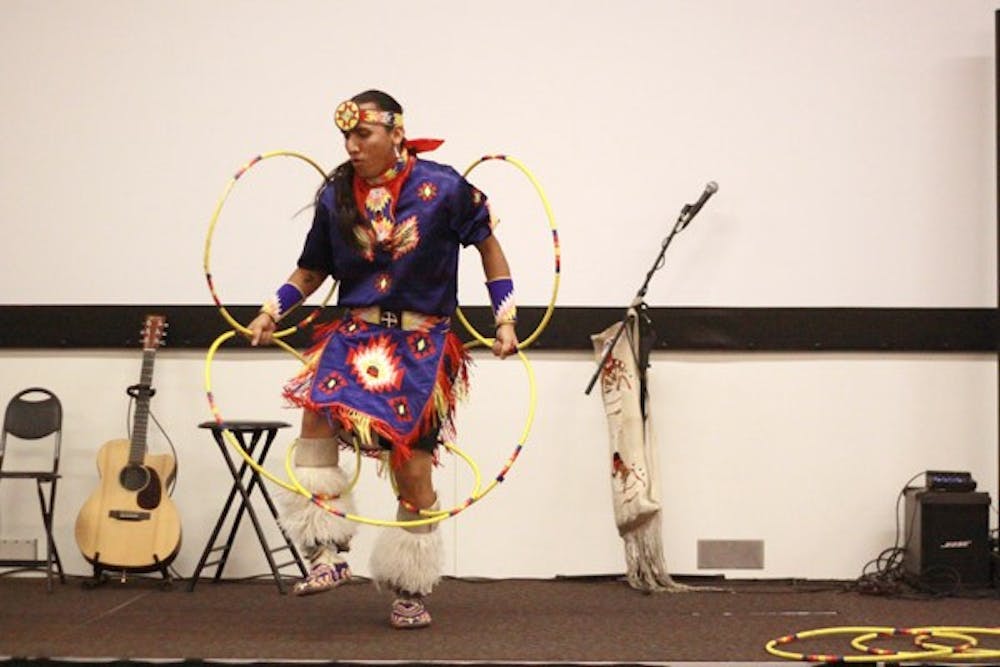 HOOP SKILS: World-renowned hoop dancer Tony Duncan performs Wednesday night with his band Estun-Bah at a Project Humanities event in the Nursing and Health Innovation II building. (Photo by Lillian Reid)