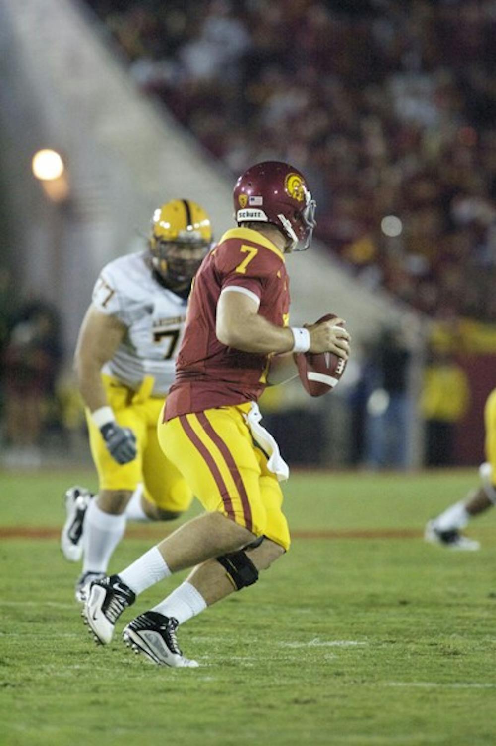 READY FOR BATTLE: USC junior quarterback Matt Barkley drops back and looks for a receiver during the Sun Devils’ loss to the Trojans in Tempe last season. USC is wary but looking for the win against ASU. (Photo by Aaron Lavinksy)