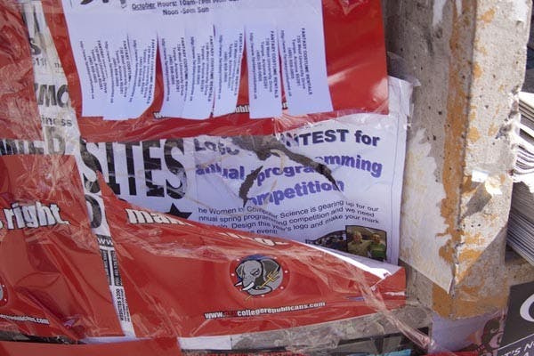 HIGH-DEMAND REAL ESTATE: ASU groups have witnessed other students ripping down posters and signs from the kiosks around campus. (Photo by Annie Wechter)