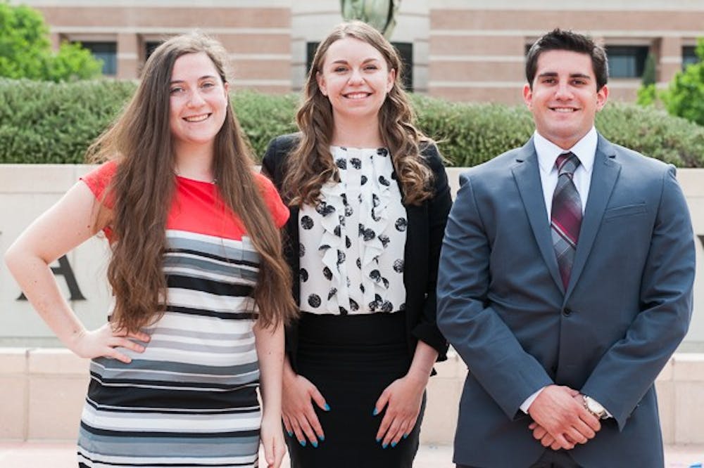 Vice President of Policy candidate Rachael Tashbook (left), presidential candidate Stephanie Bockrath and Vice President of Services candidate Joseph Muzupappa pose for a portrait on Wednesday, March 18, 2015 on the West campus. The three are running together as one executive ticket in this year's USG West election.