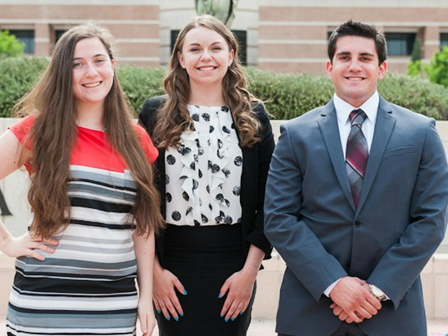 Vice President of Policy candidate Rachael Tashbook (left), presidential candidate Stephanie Bockrath and Vice President of Services candidate Joseph Muzupappa pose for a portrait on Wednesday, March 18, 2015 on the West campus. The three are running together as one executive ticket in this year's USG West election.