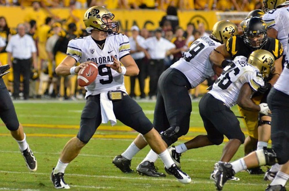 STILL THE WRONG FOOT: Colorado senior quarterback Tyler Hansen begins his throwing motion during the Buffaloes’ 48-14 loss to the Sun Devils on Saturday. CU coach Jon Embree expressed dissatisfaction at some of his players’ complacency despite being 0-5 in their first season in the Pac-12. (Photo by Aaron Lavinsky)