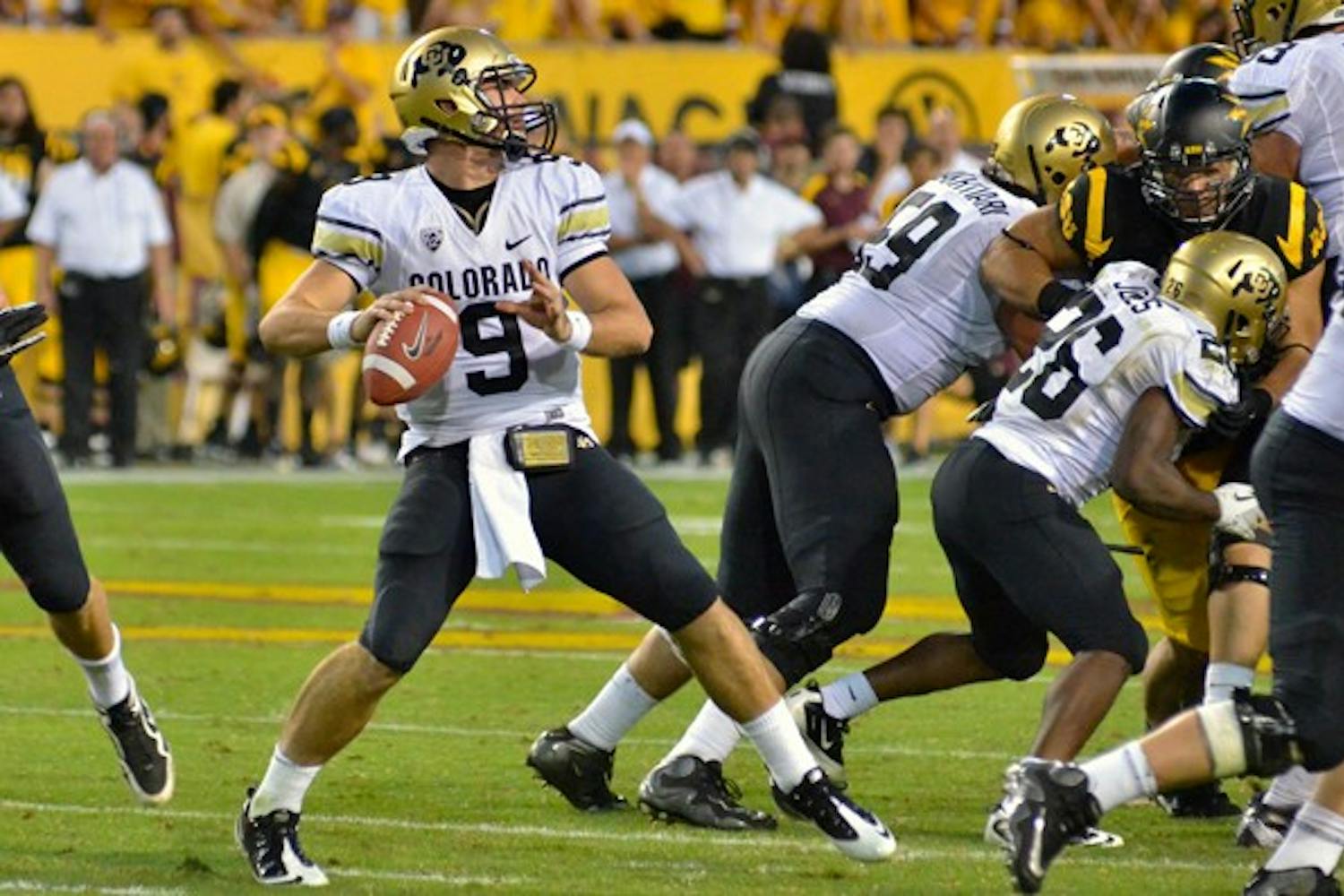 STILL THE WRONG FOOT: Colorado senior quarterback Tyler Hansen begins his throwing motion during the Buffaloes’ 48-14 loss to the Sun Devils on Saturday. CU coach Jon Embree expressed dissatisfaction at some of his players’ complacency despite being 0-5 in their first season in the Pac-12. (Photo by Aaron Lavinsky)