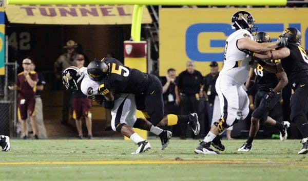 INJURY BUG: ASU sophomore Junior Onyeali makes a tackle during the Sun Devils’ OT win over Missouri on Sept. 9. Onyeali is the latest player to go down after suffering an ankle injury against Illinois on Saturday. (Photo by Beth Easterbrook)