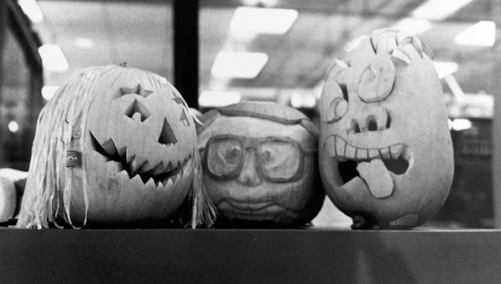 PUMPKIN ART: Carved pumpkins decorate the architecture building for Halloween in 1990. (Photo by Irwin Daugherty)