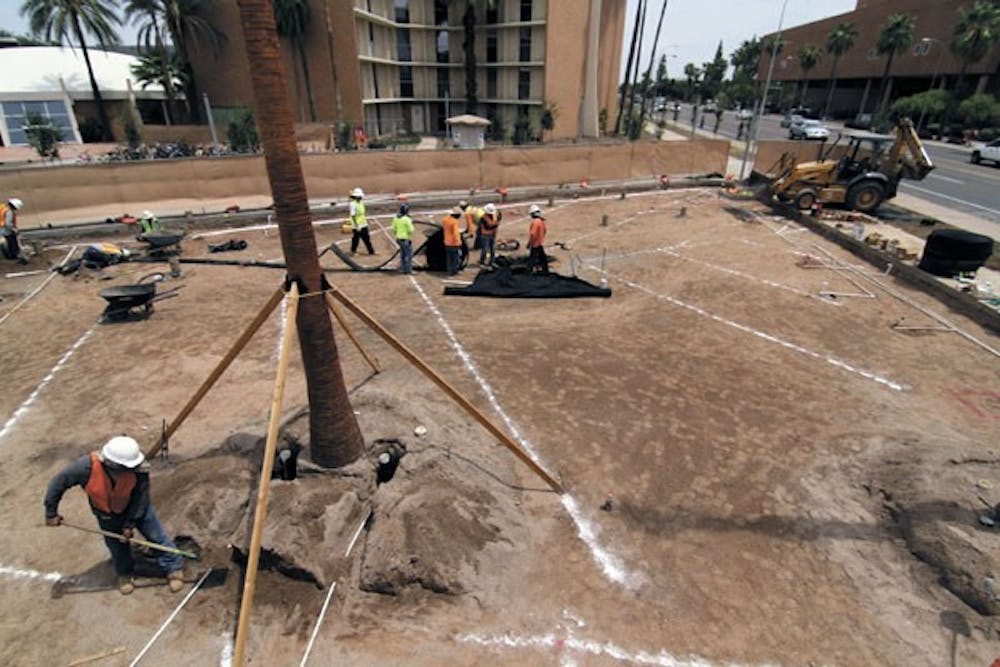 A construction crew works on the landscaping renovation on North Neighborhood on the Tempe campus. Construction is also taking place at the Student Recreation Complex and the W. P. Carey School of Business on the Tempe campus and the three other campuses. (Photo by Sam Rosenbaum)
