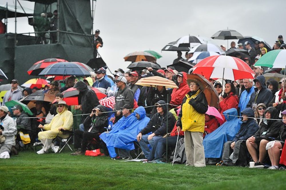 Fans huddle along the sidelines to watch Tiger Woods golf at hole 9 at the 2015 Waste Management Phoenix Open on Jan. 30, 2015. Woods finished the day with a career low 82. (Andrew Ybanez/The State Press)
