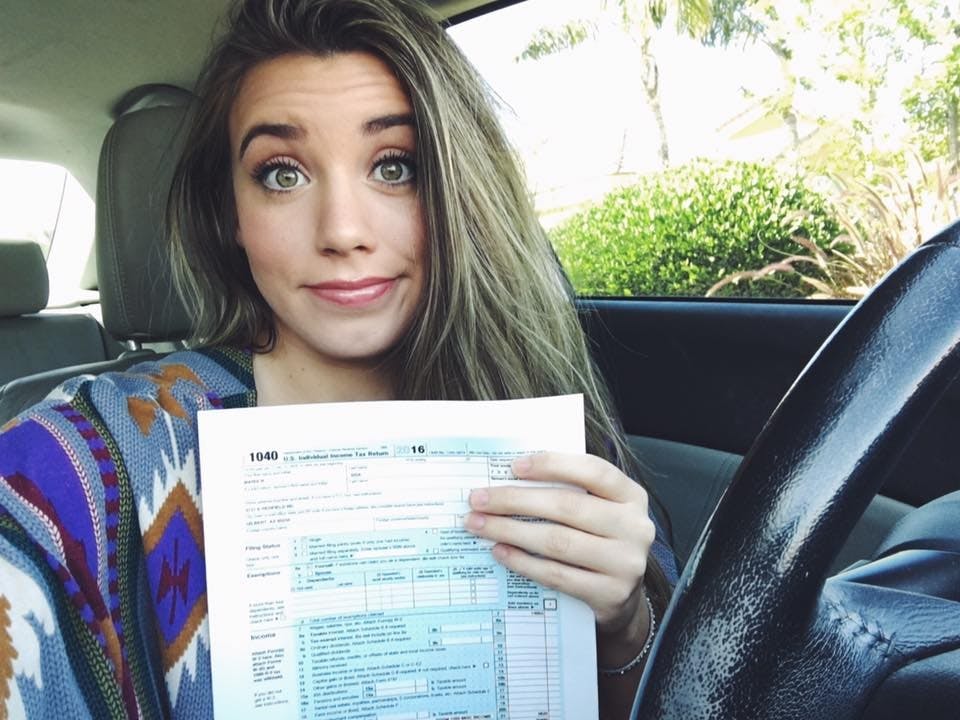 Belen Sisa poses for a photo with her tax returns on March 26, 2017.