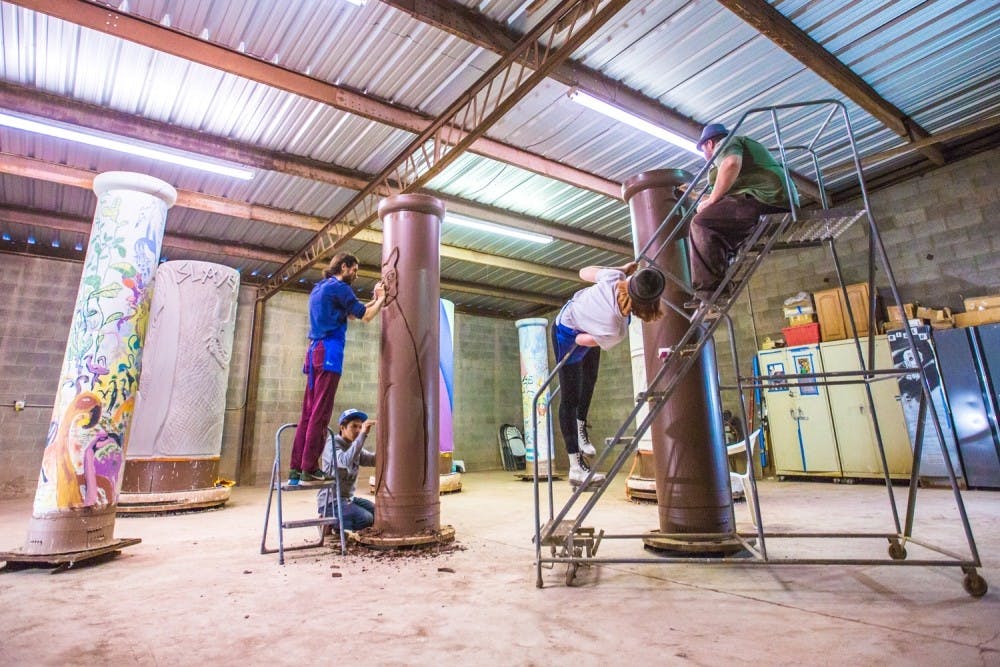 Tom Franco and Firehouse Art Collective Members working on the pipes for the "Pipe Brothers" exhibition at Mission Clay. Photo by Alex Diana