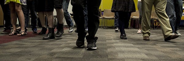 Students played "red light, green light" at DPC Aware's "Hashing Out the Gray" at the Downtown Phoenix Campus on Tuesday, Nov. 4, 2014. Students stepped forward if they agreed with the statement read aloud about relationships. (Photo by Alexis Macklin) 