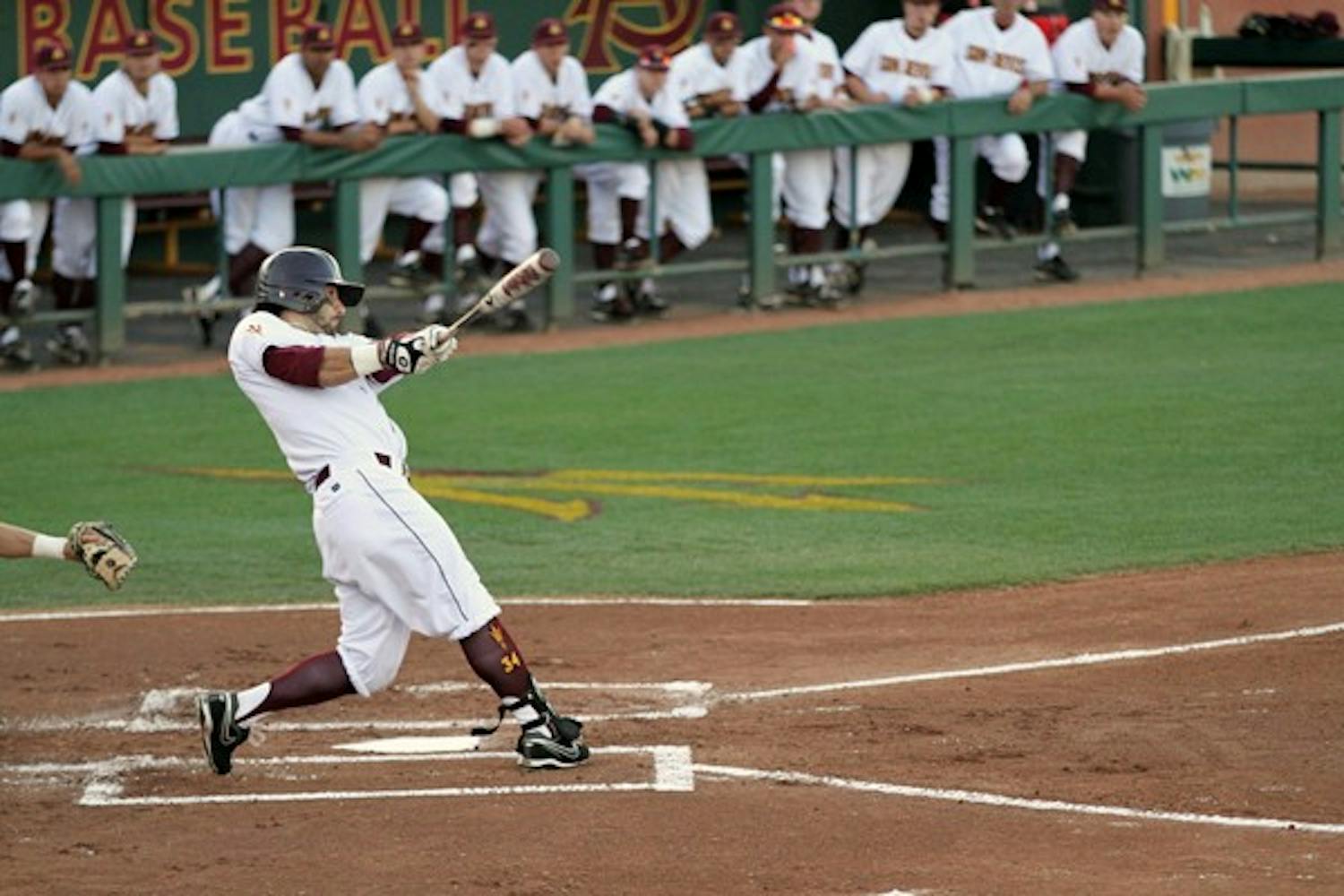 Andrew Aplin hits a home run in the first inning of Tuesday’s game against UA. Aplin finished with three hits and two RBI in the Sun Devils’ 12–8 victory over the Wildcats. (Photo by Sam Rosenbaum)