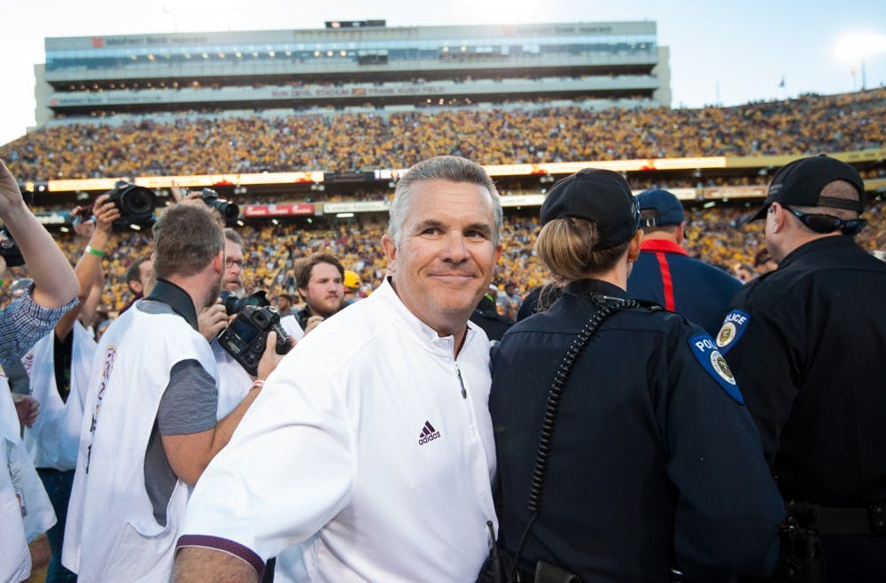 Head coach Todd Graham celebrates on the field after defeating UA on Saturday, Nov. 21, 2015, at Sun Devil Stadium in Tempe.