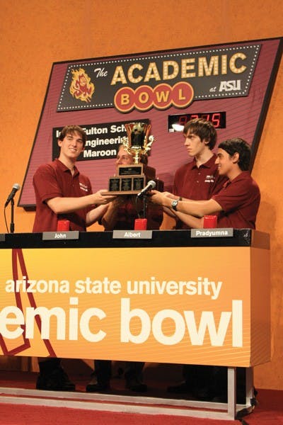 Electrical engineering major Wesley Fullmer, civil, environmental and sustainable engineering major Albert Stanton, chemical engineering major Pradyumna Kadambi and biomedical engineering major John Ernzen of the Ira A. Fulton Schools of Engineering Maroon team took home the trophy at this years Academic Bowl over the College of Liberal Arts and Sciences team with a final score of 315. (Photo by Jessie Wardarski)
