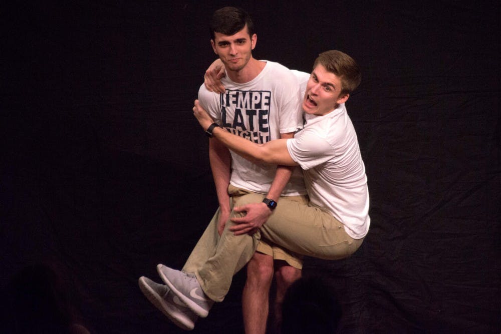 Ludwig Ahgren hangs off of Chris Cali on stage at a Tempe Late Night taping on Monday, Feb. 29, 2016 in the basement of the Memorial Union.