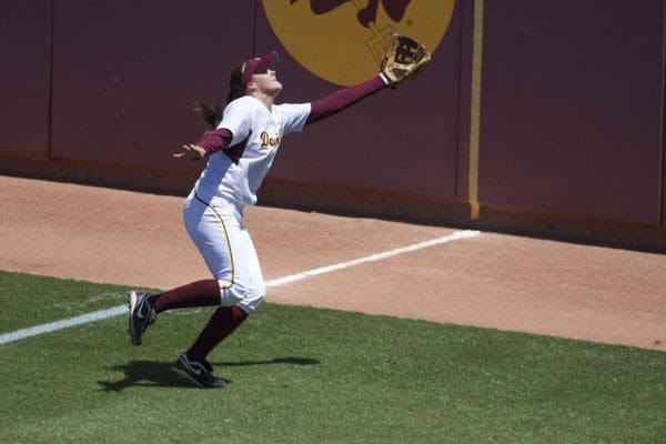 REACHING OUT: Sophomore right fielder Annie Lockwood tries to catch a foul ball during ASU's 3-0 win over Oregon on Sunday. The Sun Devils head up to Stanford for a three-game set this weekend. (Photo by Scott Stuk)