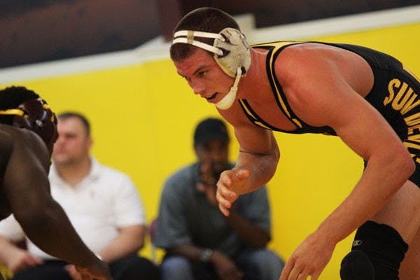 Redshirt senior 184-pound wrestler Jake Meredith (right) stands toe-to-toe against redshirt sophomore Kevin Radford during the Sun Devils’ Maroon and Gold Wrestle-Offs on Oct. 26. (Photo by Kyle Newman)