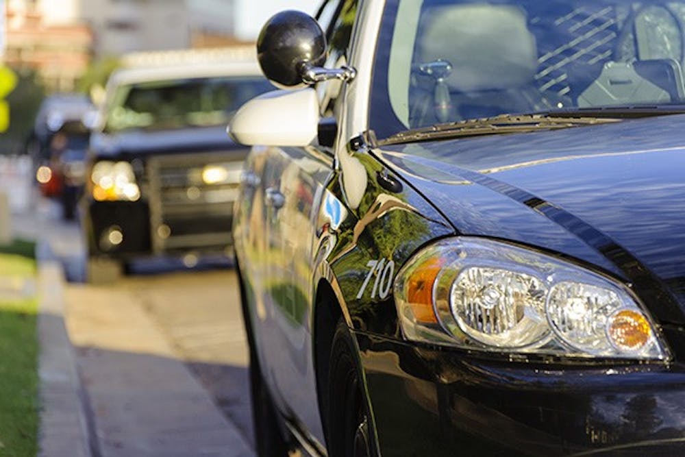 A police car is seen outside the Tempe Police Department headquarters in Tempe, Oct. 16, 2014. (Photo by Ben Moffat)