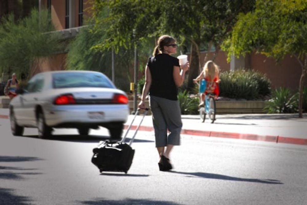 WATCH WHERE YOU CROSS: Fairly soon, people may be ticketed for jaywalking. Starting Aug. 30, ASU police will be ticketing jaywalkers around campus. (Photo by Andy Jeffreys)