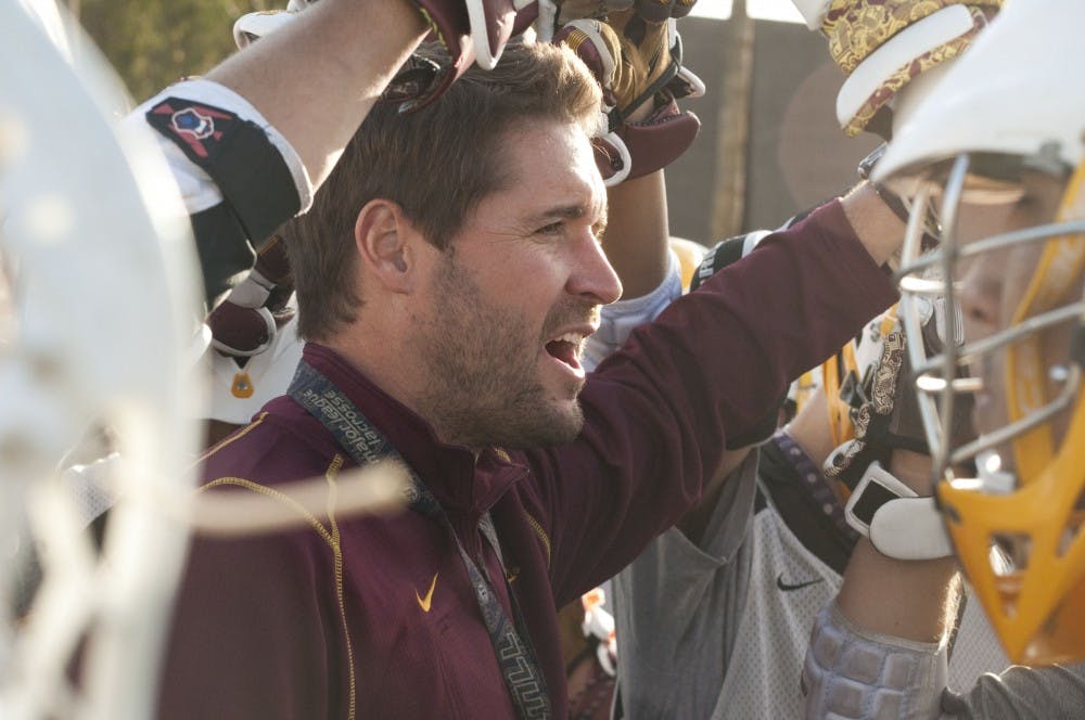 Coach Malone pumps up the players. Photo by XXX.