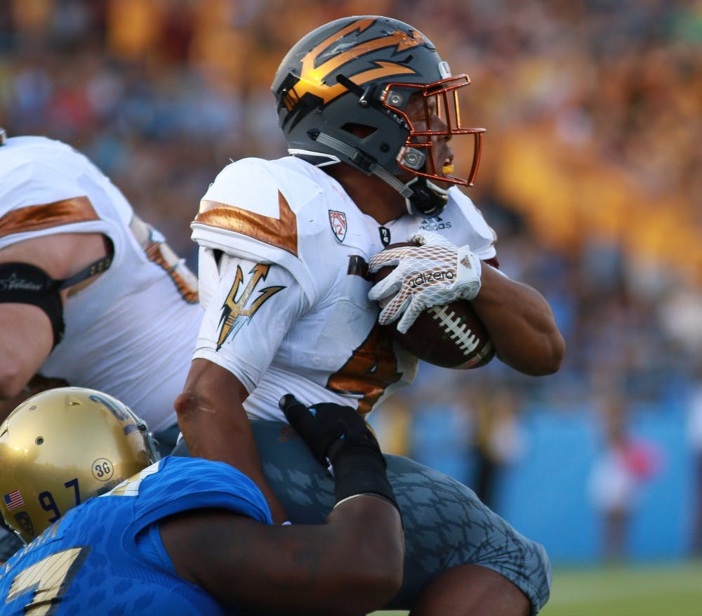 Sophomore running back Demario Richard (4) runs for gain in the second quarter against UCLA on Saturday, Oct. 3, 2015, at Rose Bowl in Pasadena, California. The Sun Devils lead 15-10 over the Bruins at half. 