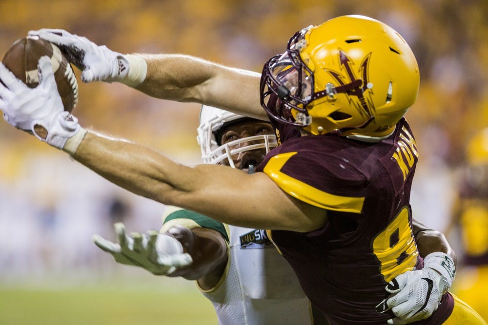 Senior wide reciever D.J. Foster pulls in a touchdown pass in the fourth quarter of a game against visiting Cal Poly at Sun Devil Stadium in Tempe on Saturday, Sept. 12, 2015. ASU beat Cal Poly 35-21 in their season opener. 