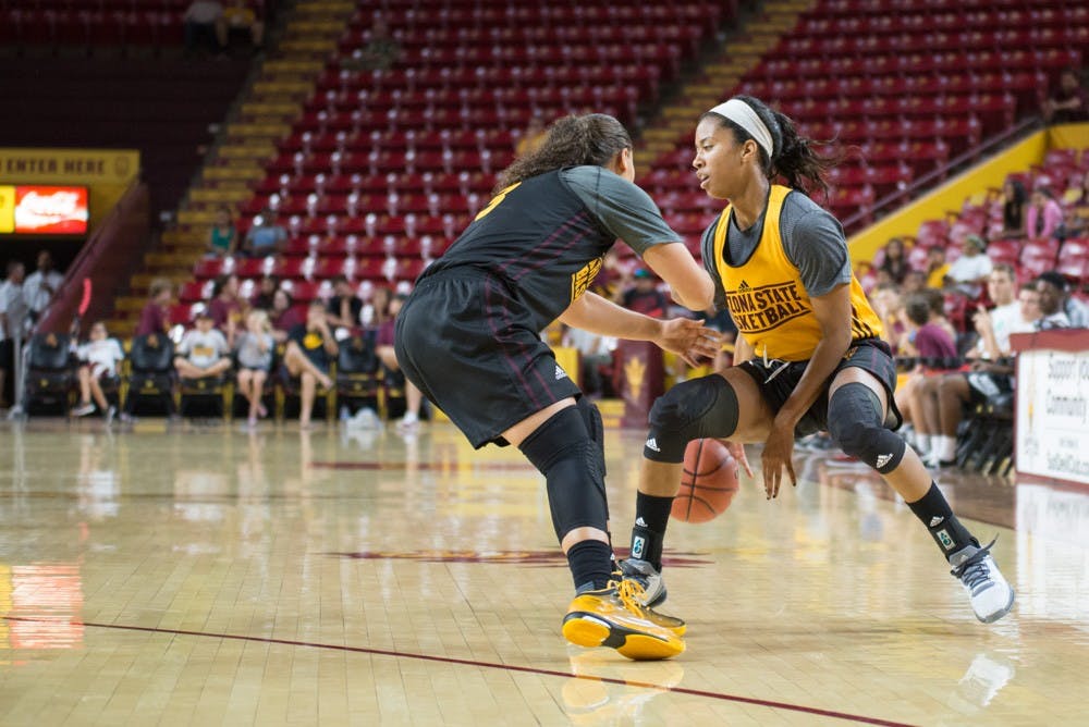 Freshman Sabrina Haynes defends against the drive by Senior,  Peace Amukamara, during the inter-squad scrimmage at the Wells Fargo Arena Oct. 9, 2015 in Tempe AZ.