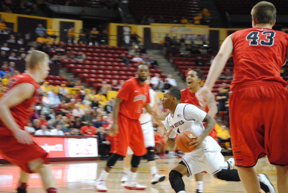 ASU plays Hartford on December 5th, 2012. I achieved motion blur sitting on the baseline by following the ball and I knew Jahii Carson was about to drive so I moved with him. A quick autofocus and shutter speed helped out a lot here. Photo by Nick Krueger. 