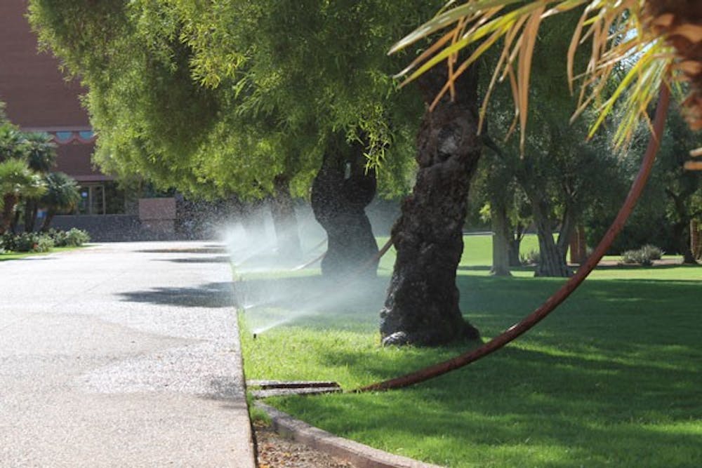 The grass near the ASU Gammage gets a nice sprinkling of water on a warm fall day. (Photo by Robin Kiyutelluk)