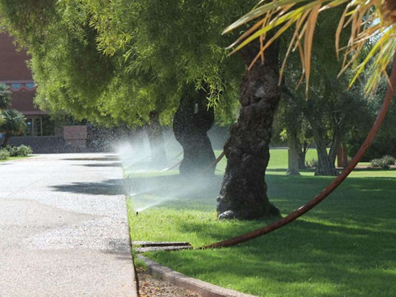 The grass near the ASU Gammage gets a nice sprinkling of water on a warm fall day. (Photo by Robin Kiyutelluk)