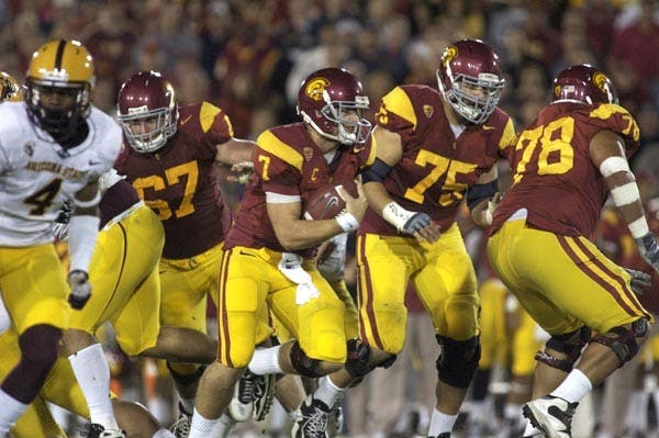 TROJAN TRIUMPH: USC sophomore quarterback Matt Barkley scrambles with the ball during the Trojans' 34-33 win over ASU on Saturday. Barkley finished the game 26-of-37 with 215 yards and three touchdowns. (Photo by Scott Stuk)