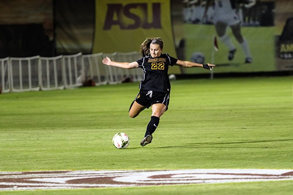 ASU defender Madison Stark tries a long through-ball at a home game on Friday, Oct. 24, 2014. Cal would defeat ASU 1-0. (Photo by Daniel Kwon)